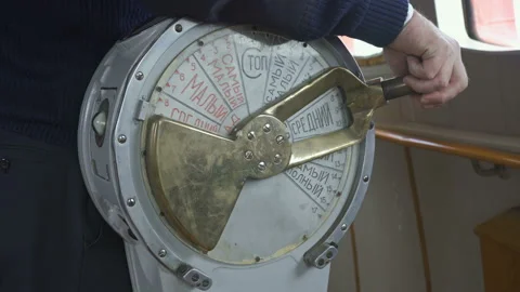 Hand turns throttle stick. Old throttle inside bridge of vessel. Captain Stock Footage 194516148