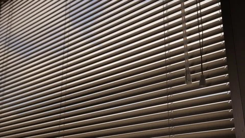 Hand twisting handle to open window blinds Stock Footage 87805714