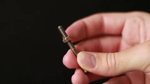 Hand twisting nut on bolt 動画素材 75629094