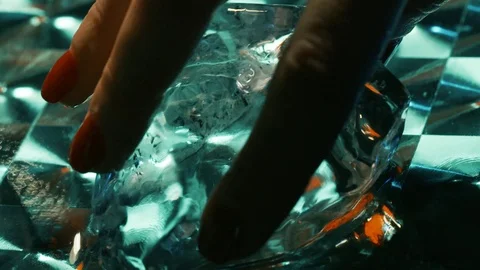 Hand twists the ice Stock Footage 121882457
