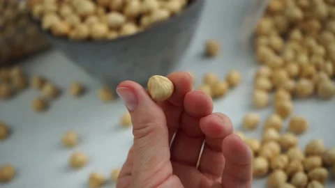 Hand twists the nut in its finger Stock Footage 199041433