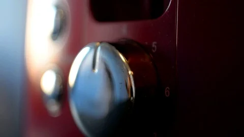 The hand twists the shiny switch of the operating modes of the machine Stock Footage 109256943