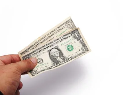 Hand with two dollar notes in a white background Stock Photos