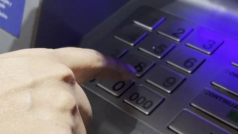 Hand types ATM access pin code, makes mistake and corrects it Stock Footage 289802208