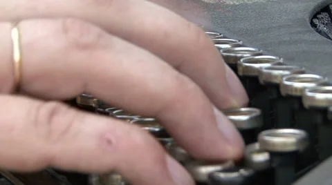 Hand on a typewriter keyboard Stock Footage 33638330