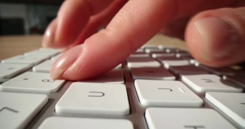 Hand typing on computer keyboard closeup Video stock 255190058
