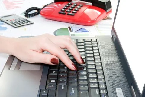 Hand typing on computer keyboard Stock Photos