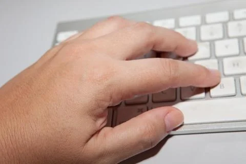 Hand typing in computer keyboard Stock Photos