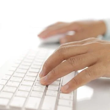 Hand typing computer keyboard Stock Photos