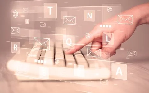 Hand typing on keyboard with digital tech icons Stock Photos