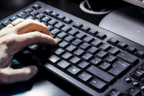 Hand typing on the keyboard Stock Photos