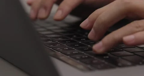 Hand typing on laptop keyboard. close-up shot of finger using track pad Stock Footage 237763437