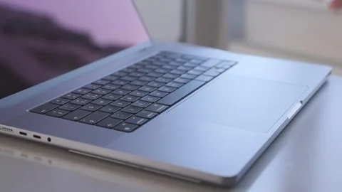 Hand typing on a laptop keyboard, a close up view. Video stock 276896549