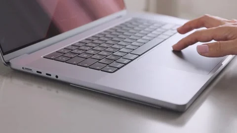 Hand typing on a laptop keyboard, a close up view. Stock Footage 276896550