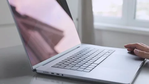 Hand typing on a laptop keyboard, a close up view. Stock Footage 276896551