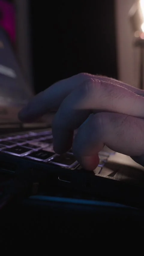 Hand typing on laptop keyboard close up vertical video Video stock 332983846