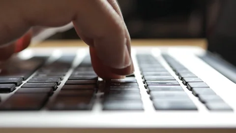 Hand typing on laptop keyboard Stock Footage 104361937