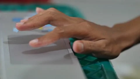 A hand typing on a laptop keyboard at work Stock Footage 239761838