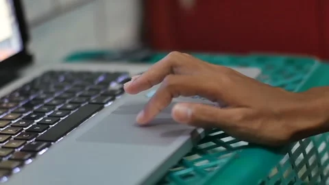 A hand typing on a laptop keyboard at work Stock Footage 239783141