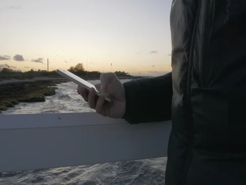 Hand typing sms mms on a smartphone Stock Footage 82211347