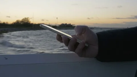 Hand typing sms mms on a smartphone Stock Footage 82212045