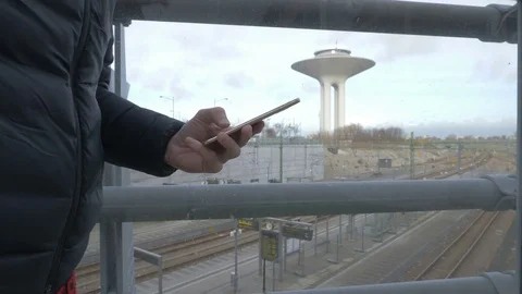 Hand typing sms mms on a smartphone Stock Footage 82324802