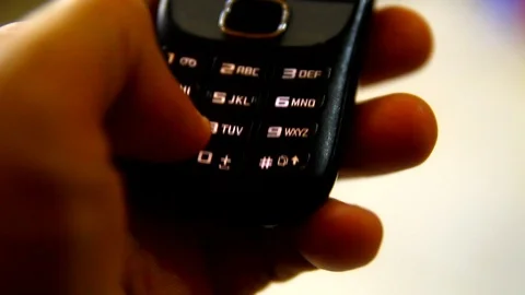 Hand typing a text on a cellphone Stock Footage 98435740