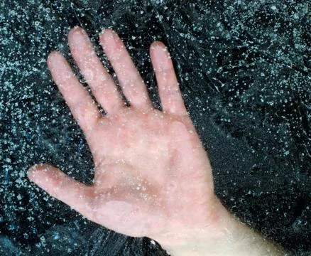 Hand under the ice Stock Photos