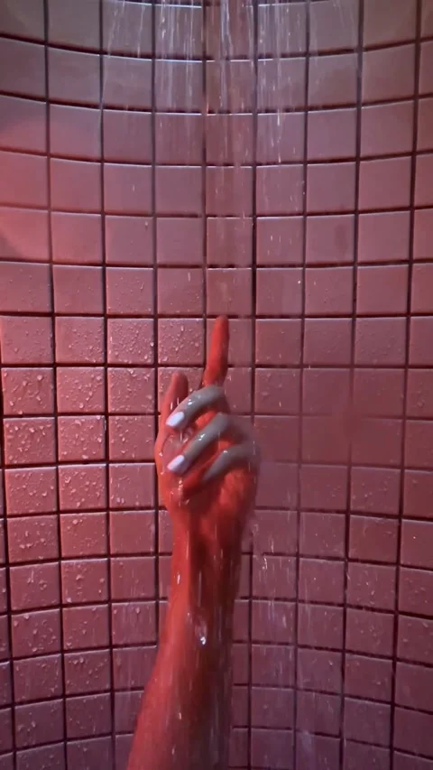 Hand under running water on a background of square tiles Stock Footage 283816618