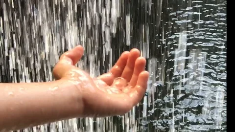 The hand under the waterfall slowly Stock Footage 90811720