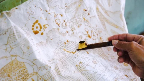 Hand of unknown man make batik and using a Canting Stock Footage 124323864