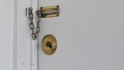 A hand is unlocking the door Stock Footage 99511359