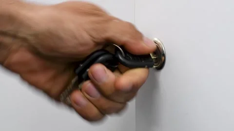Hand Unlocking Door with Key, Inserting Key into Lock and Opening Door Stock Footage 312007014
