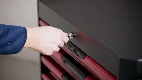 Hand unlocking tool cabinet drawer Stock Footage 326042193