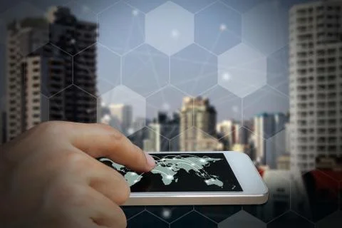 Hand use smartphone with Network connection of World map Stock Photos