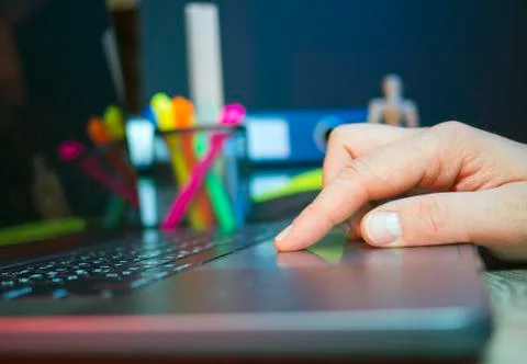 A hand use touchpad made for notebook with a light at his finger Stock Photos