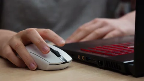Hand uses a computer mouse, close-up Stock Footage 229539642