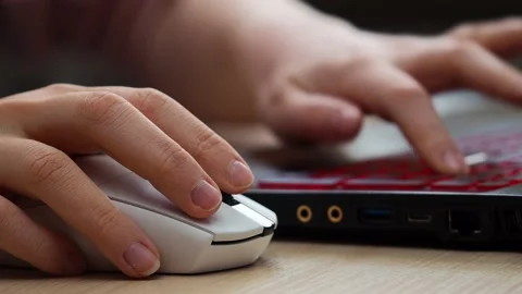 Hand uses a computer mouse, close-up Stock Footage 229539658