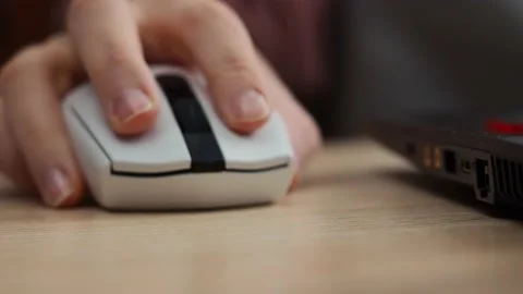 Hand uses a computer mouse, close-up Stock Footage 229539680