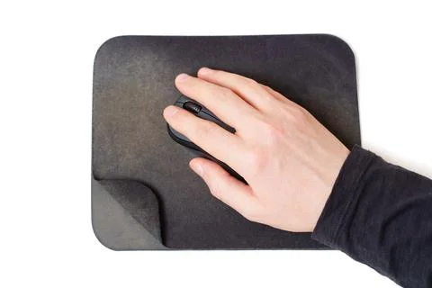 Hand Uses a Computer Mouse on an Well-Worn Pad Stock-Fotos