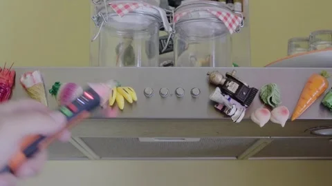 A hand uses a non-contact voltage tester to check an electrical outlet under a Video stock 342761040