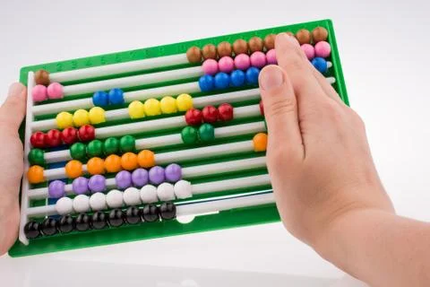 Hand using an abacus Stock Photos