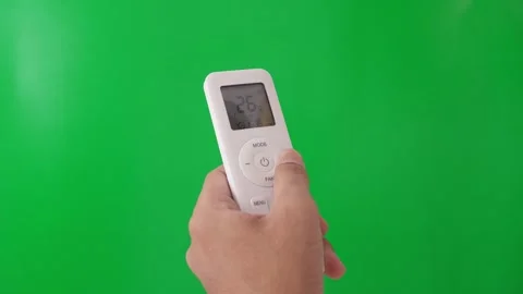 Hand using AC controller to change temperature. Stock Footage 305689158