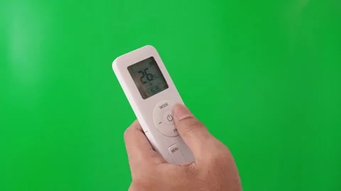 Hand using AC controller to change temperature. Stock Footage 305689185