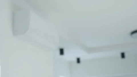 Hand using air conditioner remote control at home Stock Footage 336047178