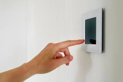 Hand using Air ventilation controller with display Stock Photos