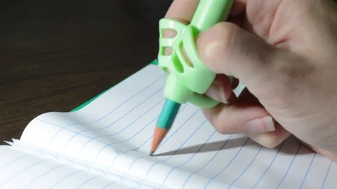 Hand using Anti-Shortsighted Pencil Holder made with Silicone for Childrens 스톡 동영상 114776187