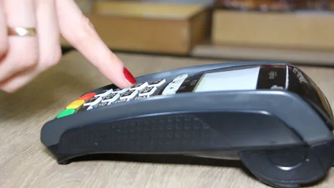 Hand using bank terminal for credit card payment Stock Footage 89869268