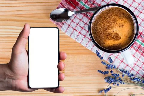 Hand using bezel less smart phone with blank screen. Stock Photos