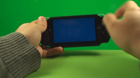Hand Using A Blue Screen Portable Game System On A Green Screen, Chroma, Key Stock Footage 38688618